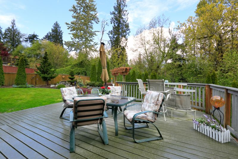 family home deck with a dining area and potted plant